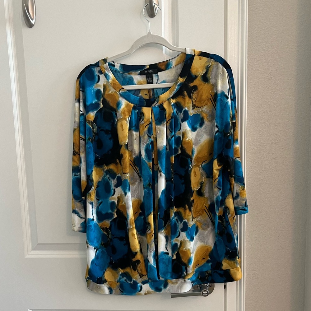Blue, black and yellow long sleeve blouse.